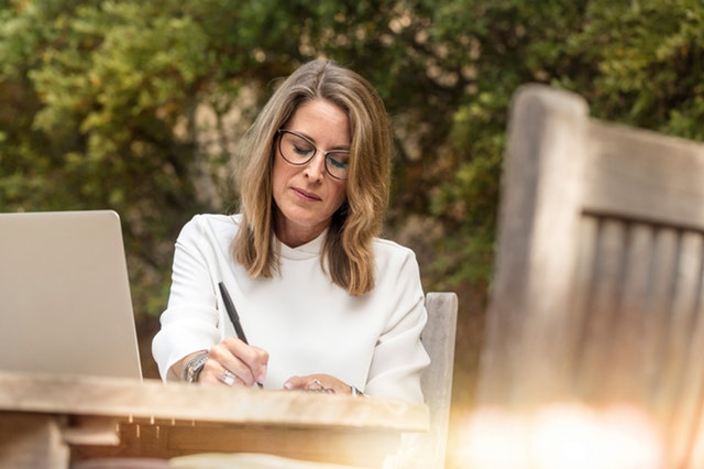 woman sitting outside, preparing for her interview